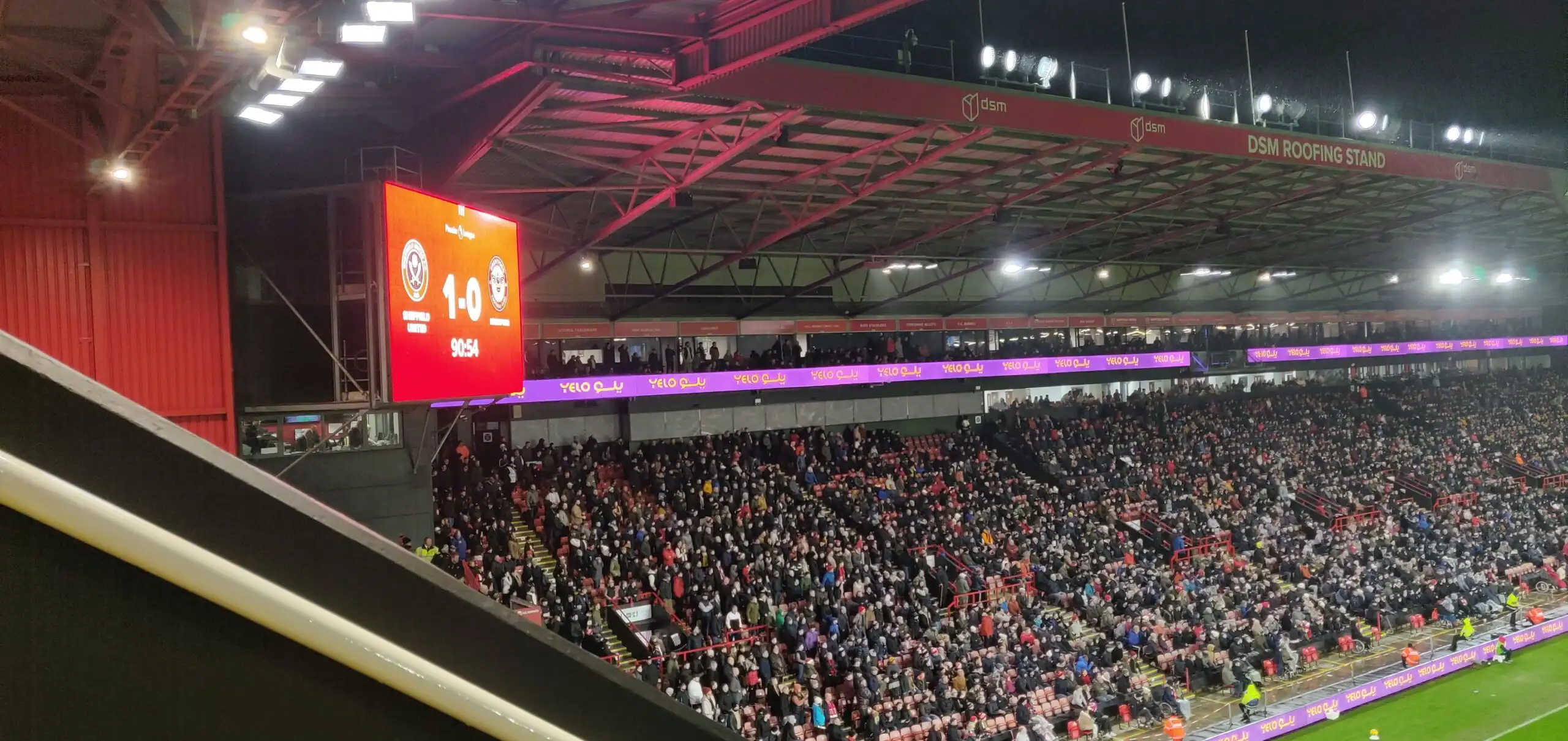 a view of DSM roofing stand when and the corner screen stating 1-0 favouring Sheffield united vs brentford EPL season 23/24