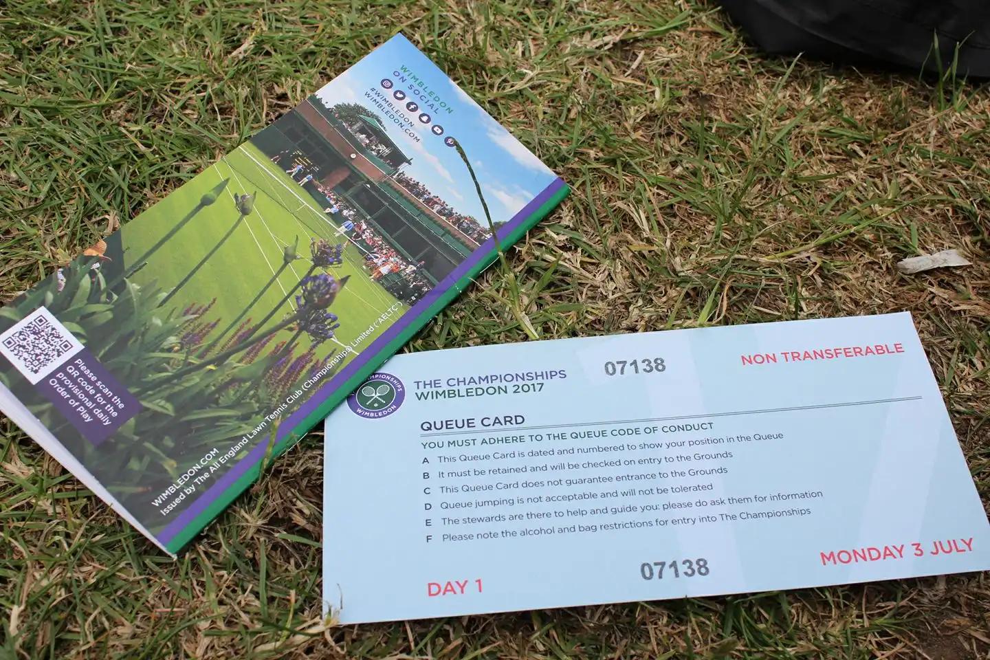 Photo of Queue Card on a grass